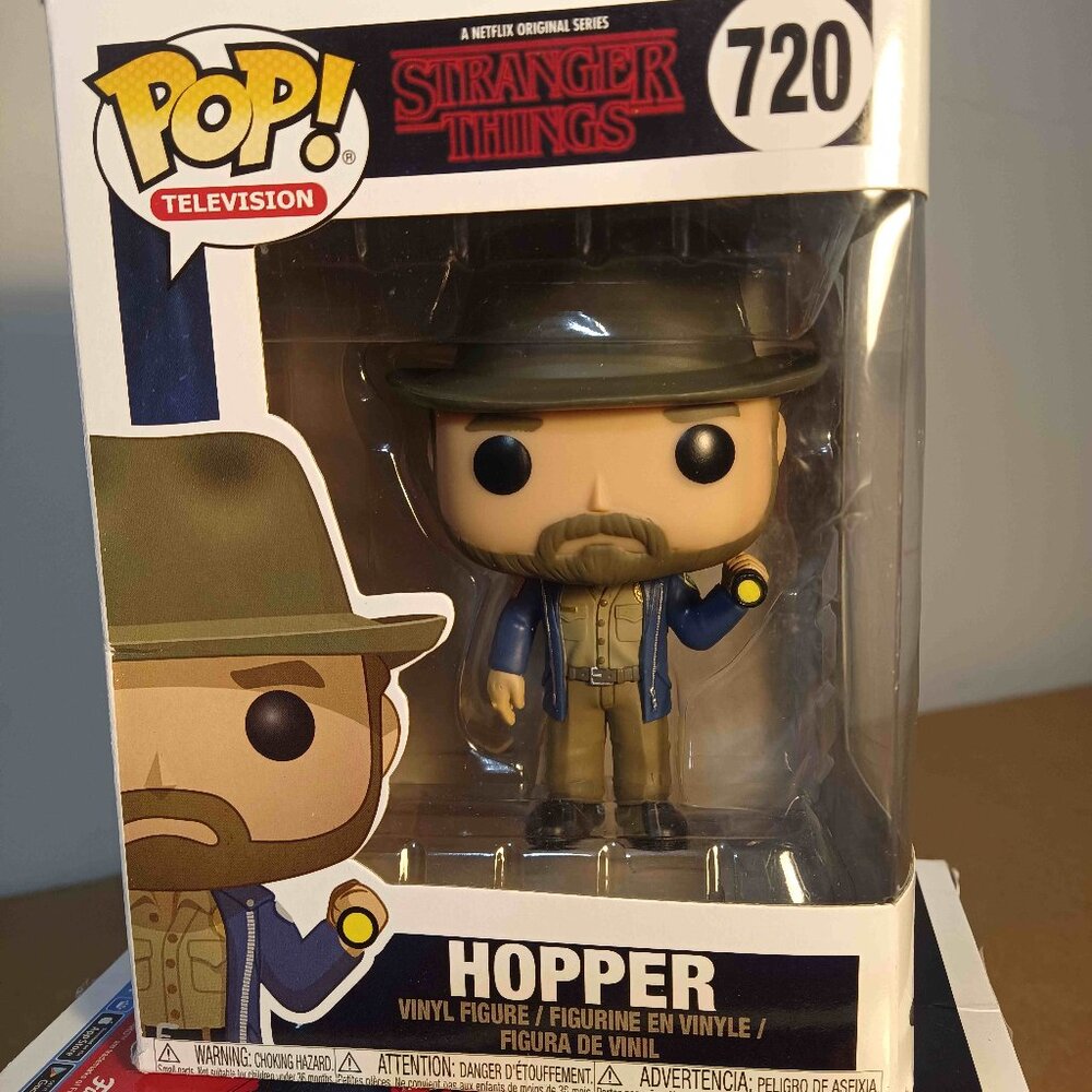Stranger Things Hopper w/ Flashlight vinyl figure.